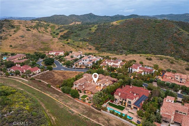 an aerial view of residential houses and outdoor space