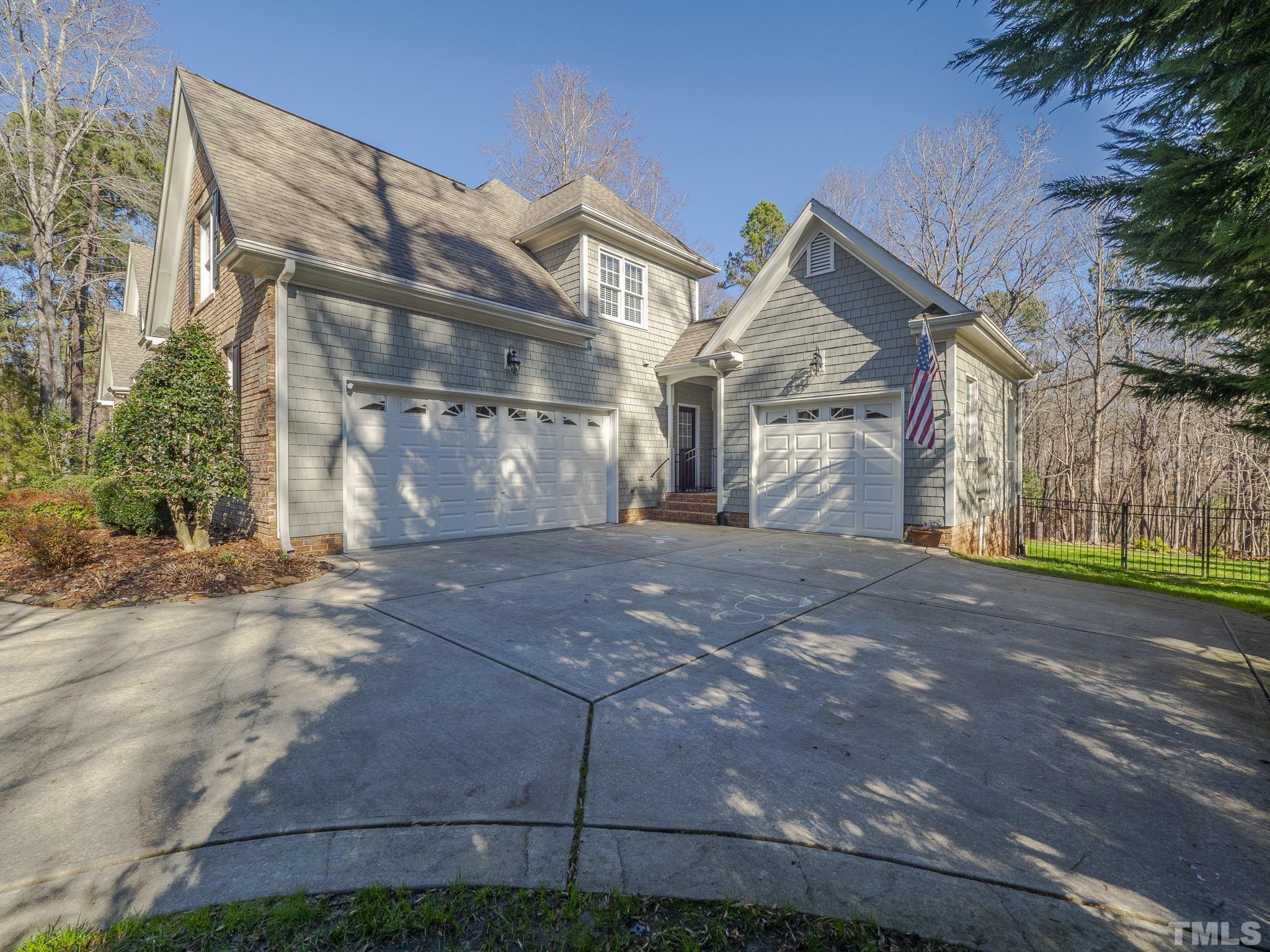 7112 Anglesey Court Wake Forest, NC 27587 - Photo 23 of 23 a front view of a house with a yard and a garage