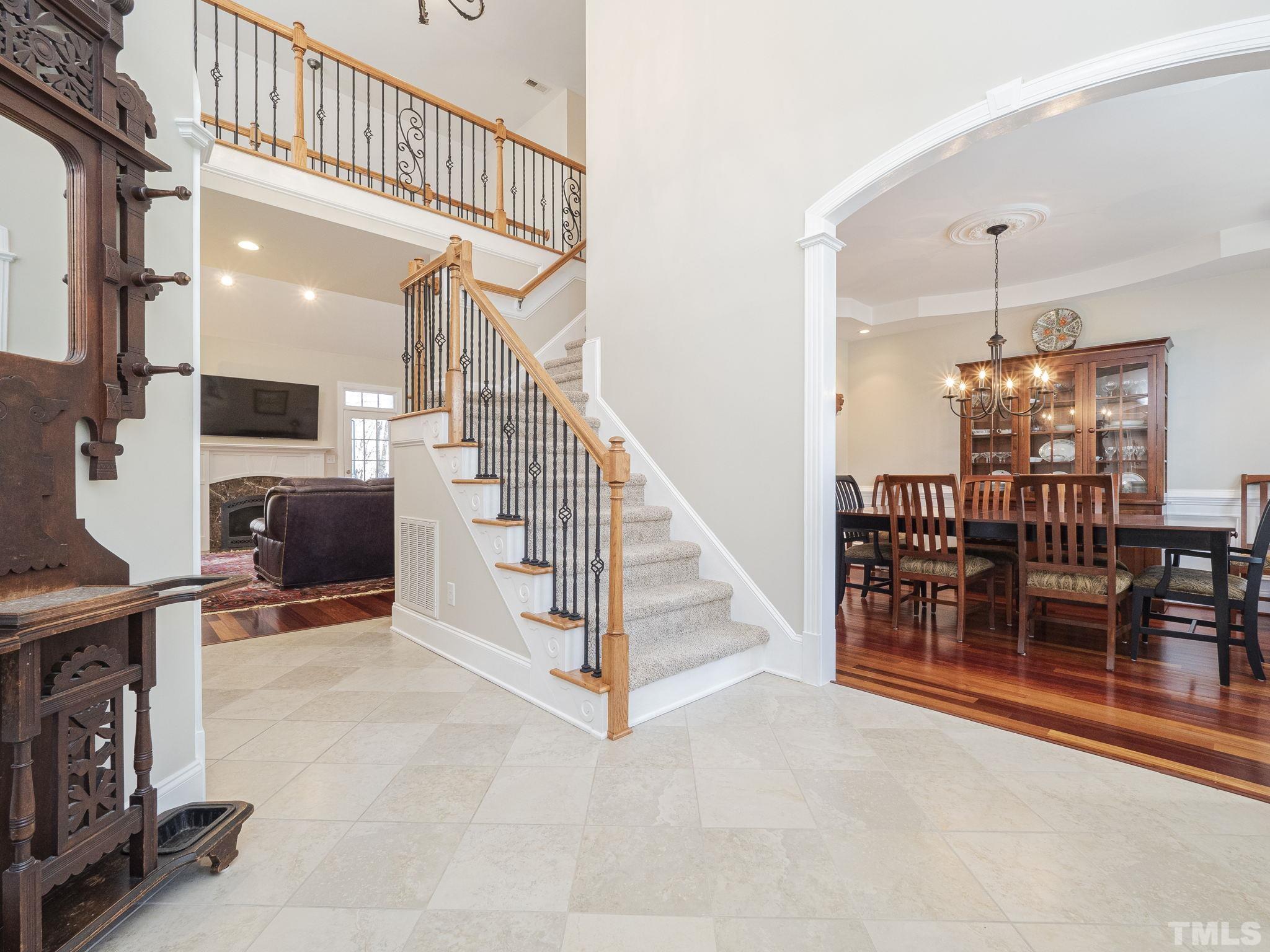 7112 Anglesey Court Wake Forest, NC 27587 - Photo 4 of 23 a view of a livingroom with furniture and staircase