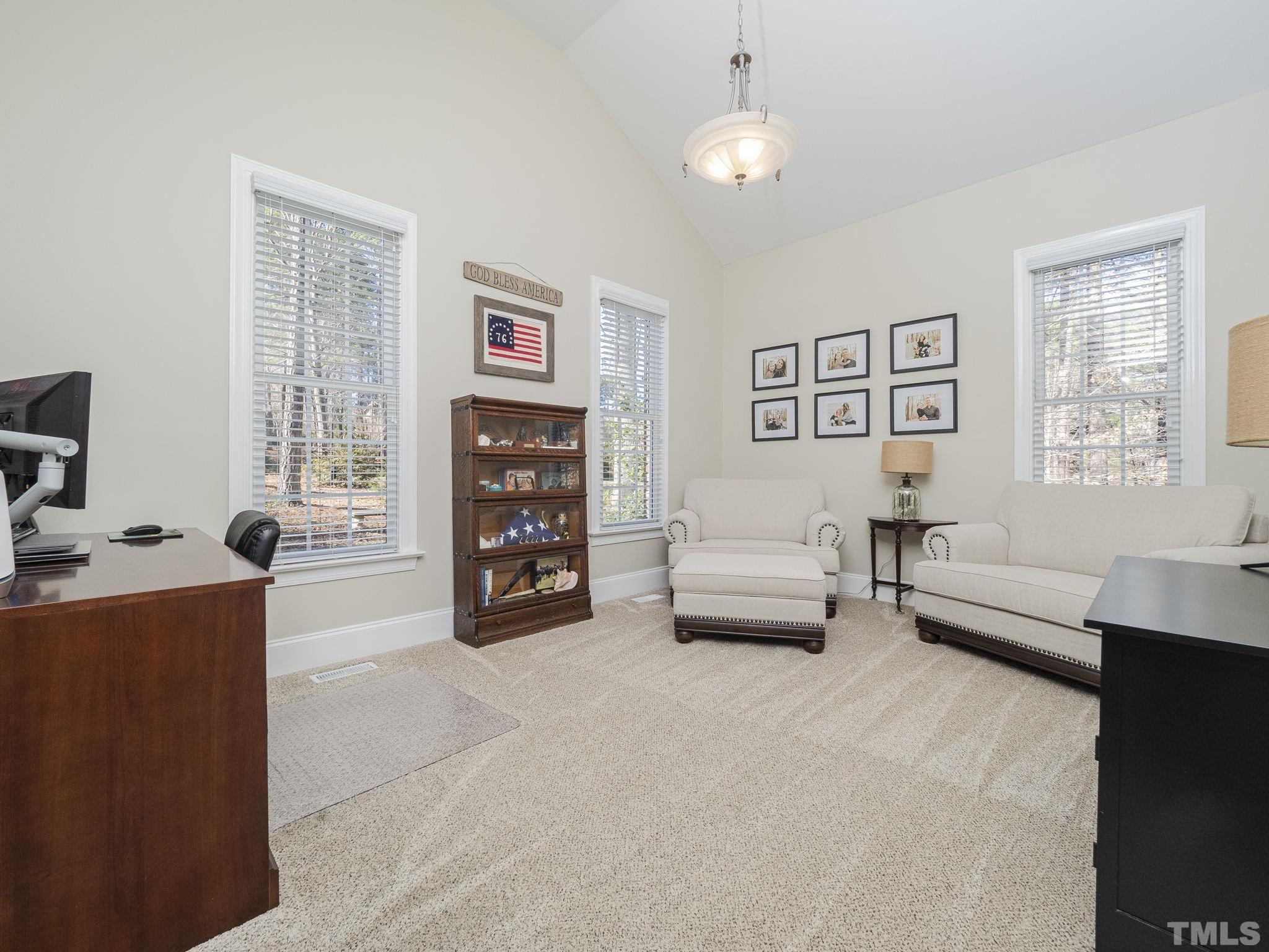 7112 Anglesey Court Wake Forest, NC 27587 - Photo 5 of 23 a view of a livingroom with furniture and a window