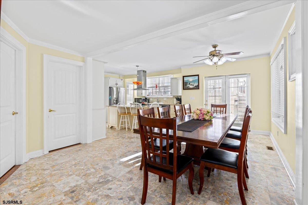 104 South Oakland Avenue, Unit JUNE '26 Ventnor City, NJ 08406 - Photo 11 of 57 a view of a dining room with furniture