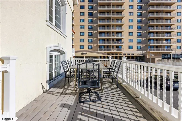 a view of a balcony with chairs
