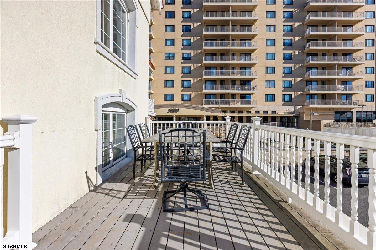 104 South Oakland Avenue, Unit JUNE '26 Ventnor City, NJ 08406 - Photo 14 of 57 a view of a balcony with wooden floor