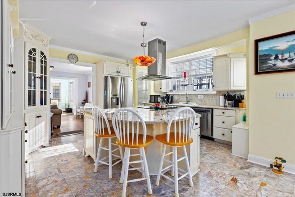 a kitchen with granite countertop a sink and cabinets