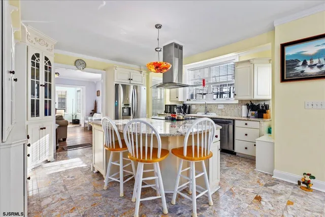a kitchen with granite countertop a sink and cabinets