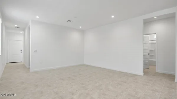an empty room with a bathroom