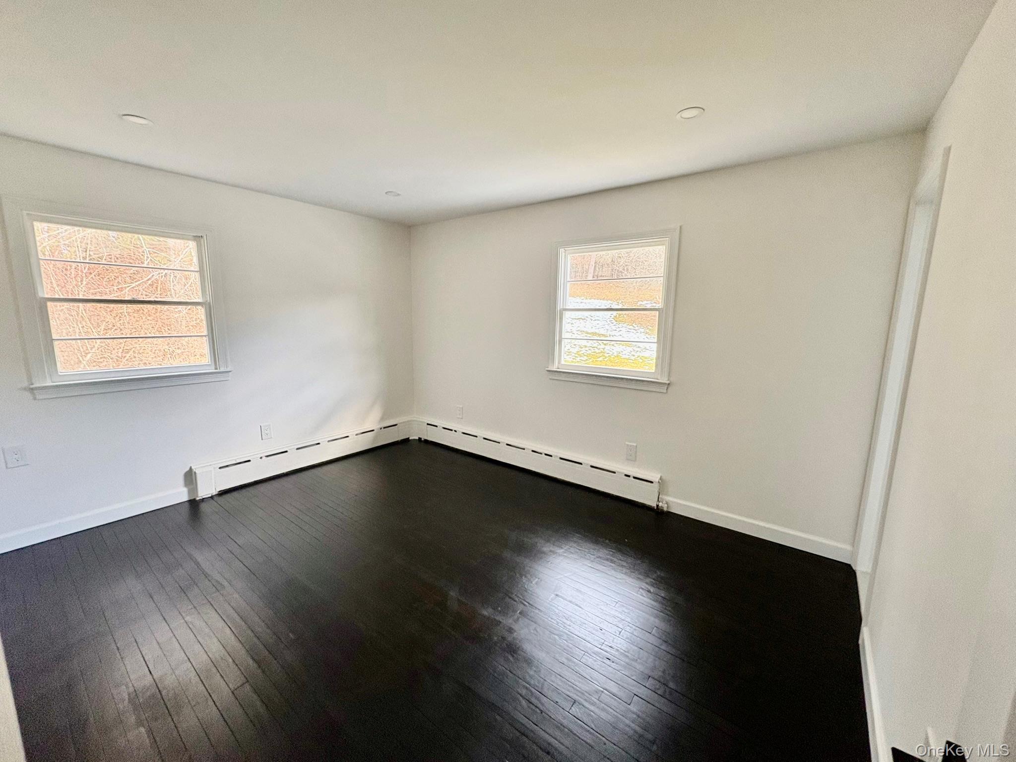 5852 State Rte 55 Liberty, NY 12754 - Photo 14 of 44 a view of an empty room with wooden floor and a window