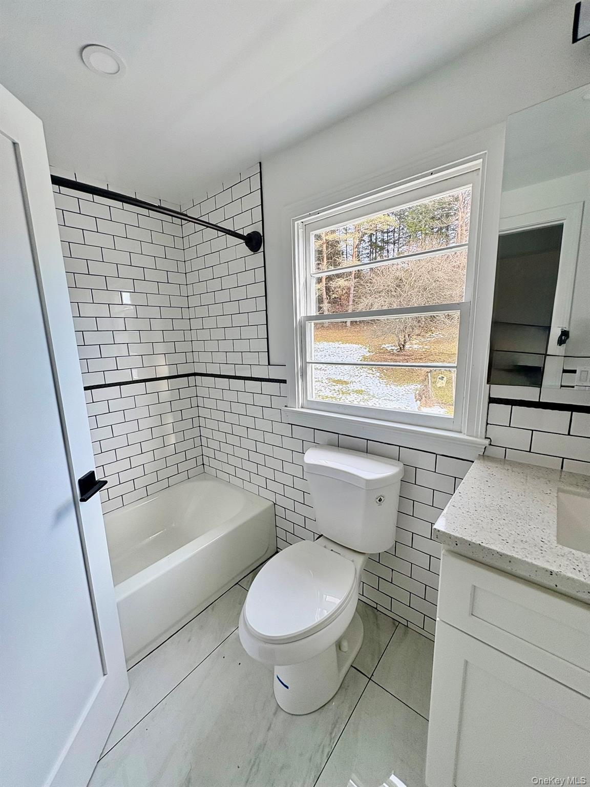5852 State Rte 55 Liberty, NY 12754 - Photo 21 of 44 a bathroom with a sink a toilet and a bathtub