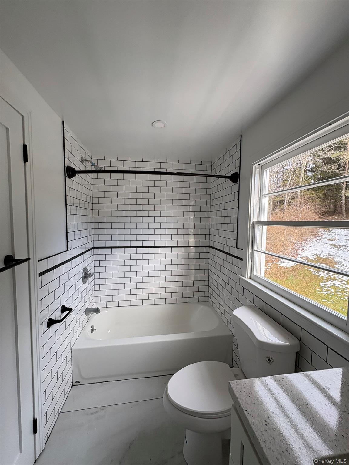 5852 State Rte 55 Liberty, NY 12754 - Photo 22 of 44 a bathroom with a bathtub and window