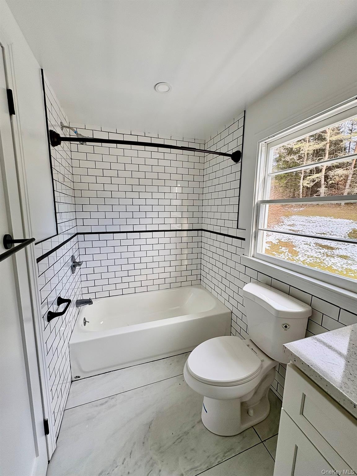 5852 State Rte 55 Liberty, NY 12754 - Photo 23 of 44 a bathroom with a toilet and a bathtub