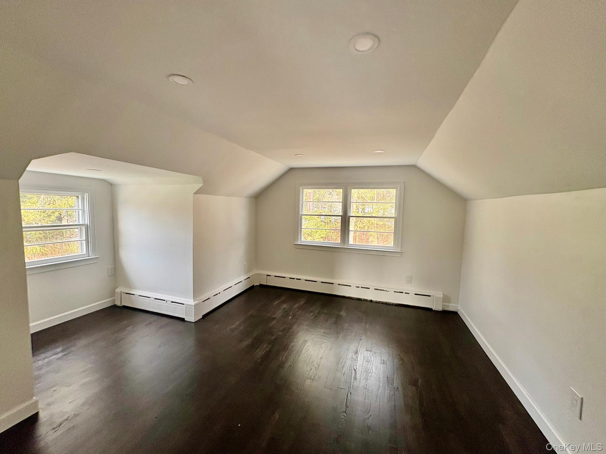 5852 State Rte 55 Liberty, NY 12754 - Photo 25 of 44 an empty room with wooden floor and windows
