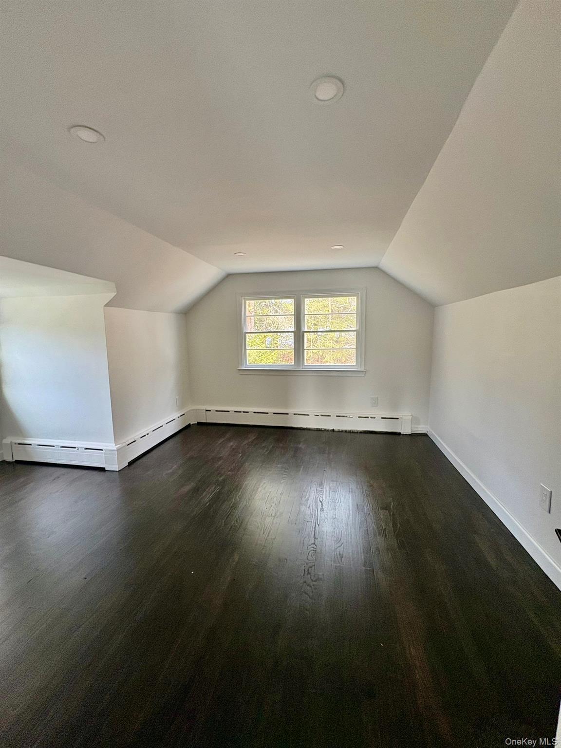 5852 State Rte 55 Liberty, NY 12754 - Photo 26 of 44 an empty room with wooden floor and windows