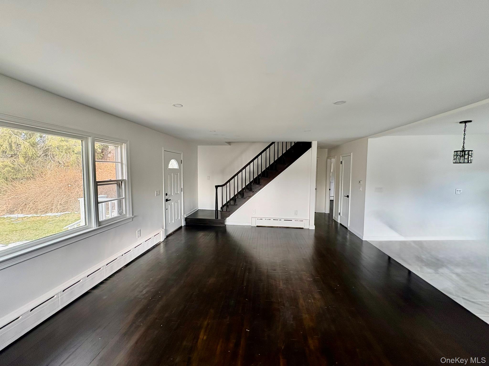 5852 State Rte 55 Liberty, NY 12754 - Photo 5 of 44 a view of an empty room with wooden floor and a window