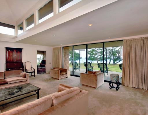 253 Long Neck Point Road Darien, CT 06820 - Photo 12 of 15 a living room with furniture and large windows