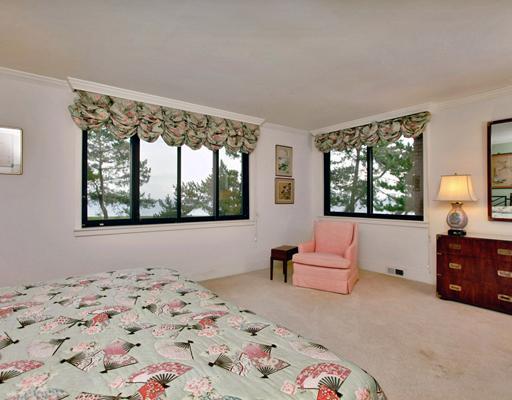 253 Long Neck Point Road Darien, CT 06820 - Photo 13 of 15 a bedroom with a bed and a couch