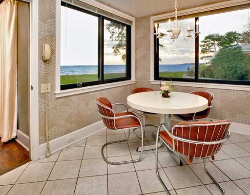 253 Long Neck Point Road Darien, CT 06820 - Photo 9 of 15 a dining room with furniture and window in the back