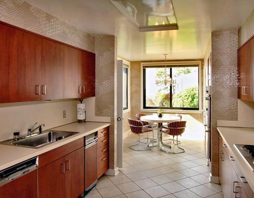 253 Long Neck Point Road Darien, CT 06820 - Photo 10 of 15 a kitchen with a sink stove and cabinets