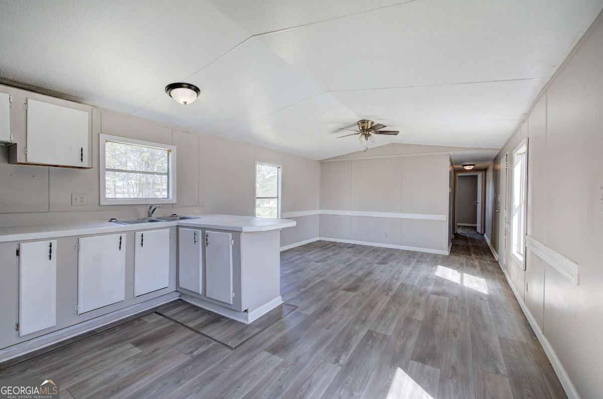 14 High Bluff Road Northeast Rome, GA 30165 - Photo 15 of 29 a view of a kitchen with wooden floor and a window