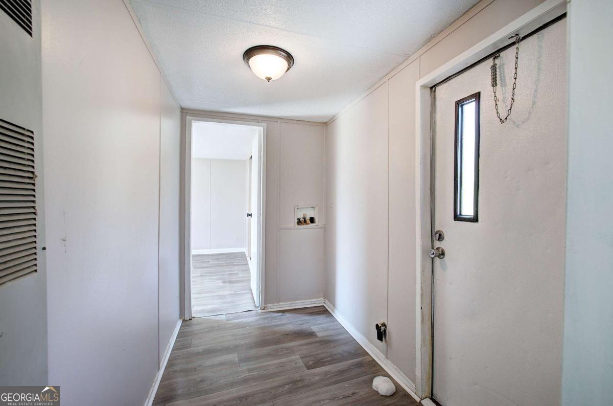 14 High Bluff Road Northeast Rome, GA 30165 - Photo 16 of 29 a view of a hallway with wooden floor and closet
