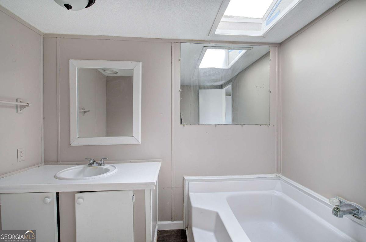 14 High Bluff Road Northeast Rome, GA 30165 - Photo 20 of 29 a bathroom with a sink and a bathtub