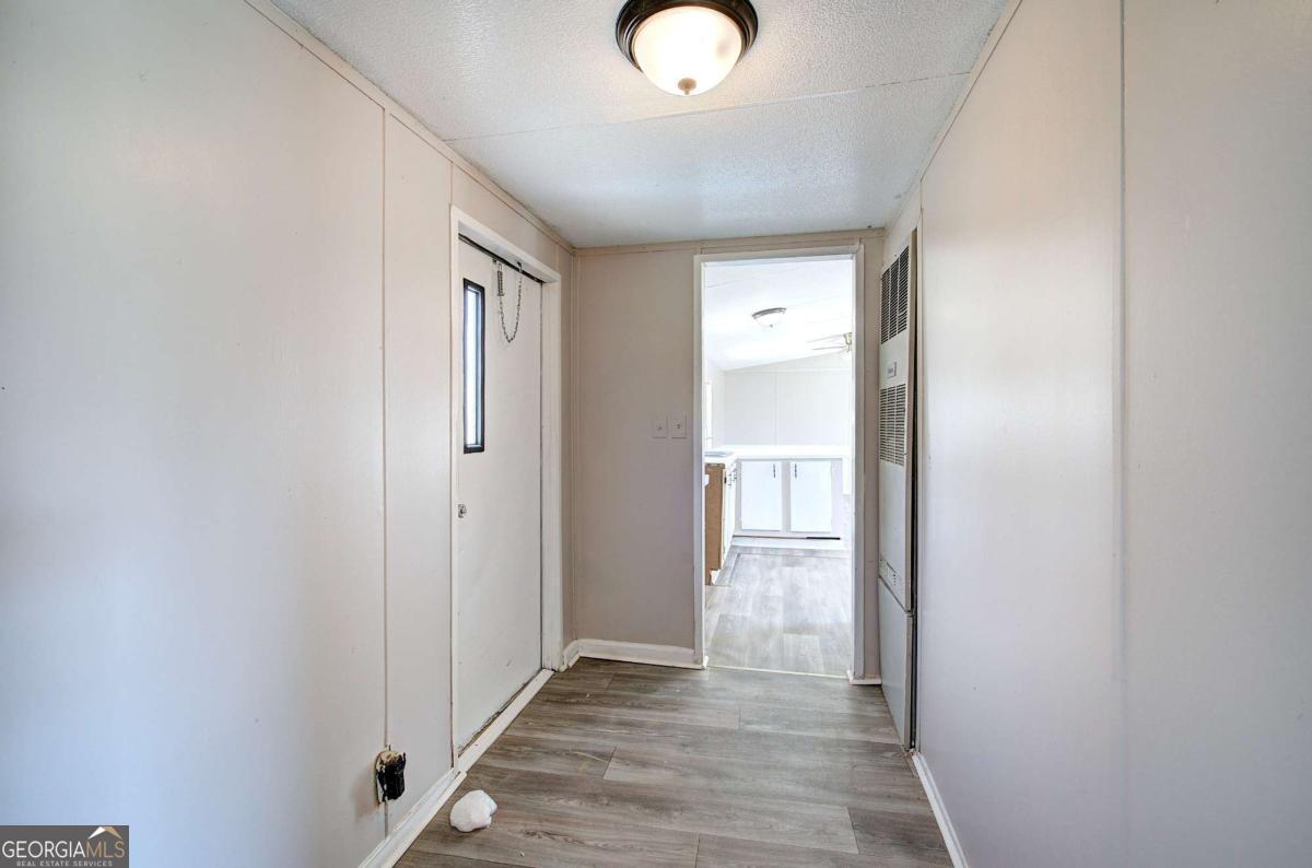 14 High Bluff Road Northeast Rome, GA 30165 - Photo 22 of 29 a view of a hallway with wooden floor