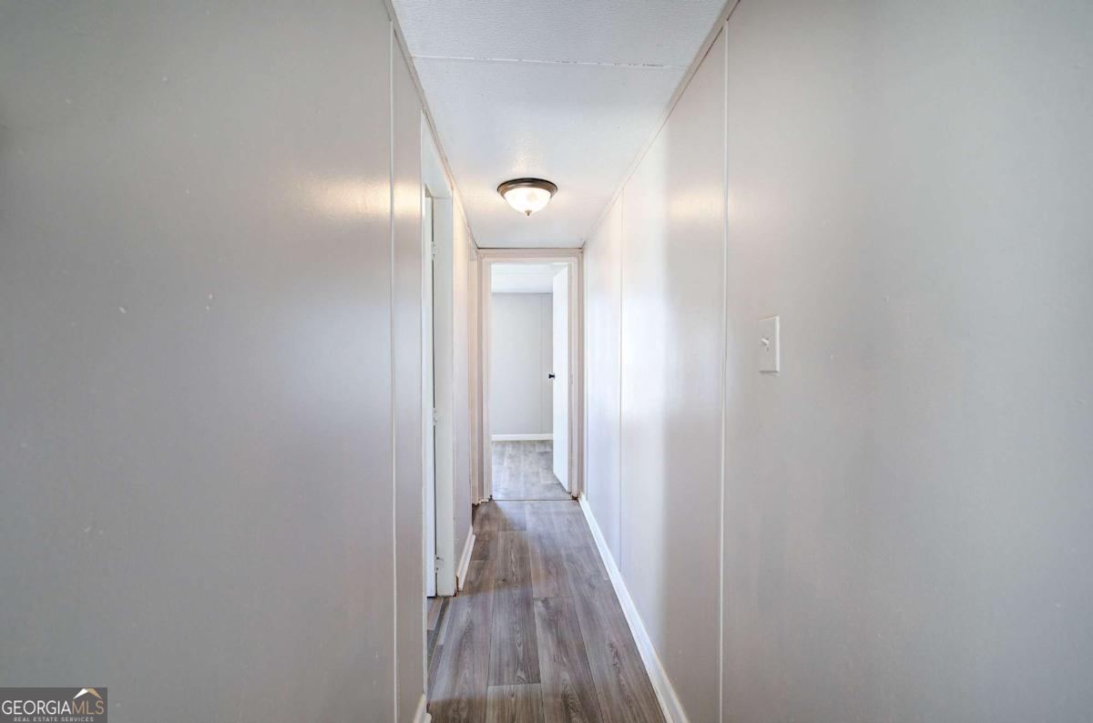 14 High Bluff Road Northeast Rome, GA 30165 - Photo 23 of 29 a view of a hallway with wooden floor