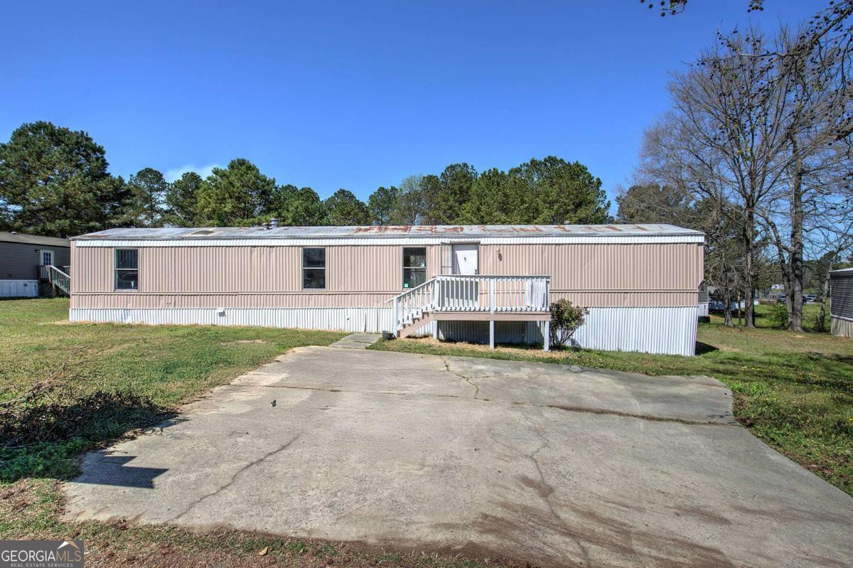 14 High Bluff Road Northeast Rome, GA 30165 - Photo 29 of 29 a view of a house with backyard and trees
