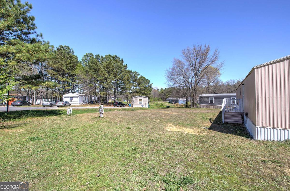 14 High Bluff Road Northeast Rome, GA 30165 - Photo 5 of 29 a view of swimming pool with outdoor seating and lake view
