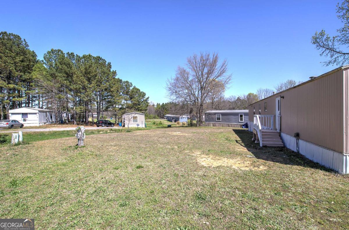 14 High Bluff Road Northeast Rome, GA 30165 - Photo 6 of 29 a view of yard with swimming pool and trees