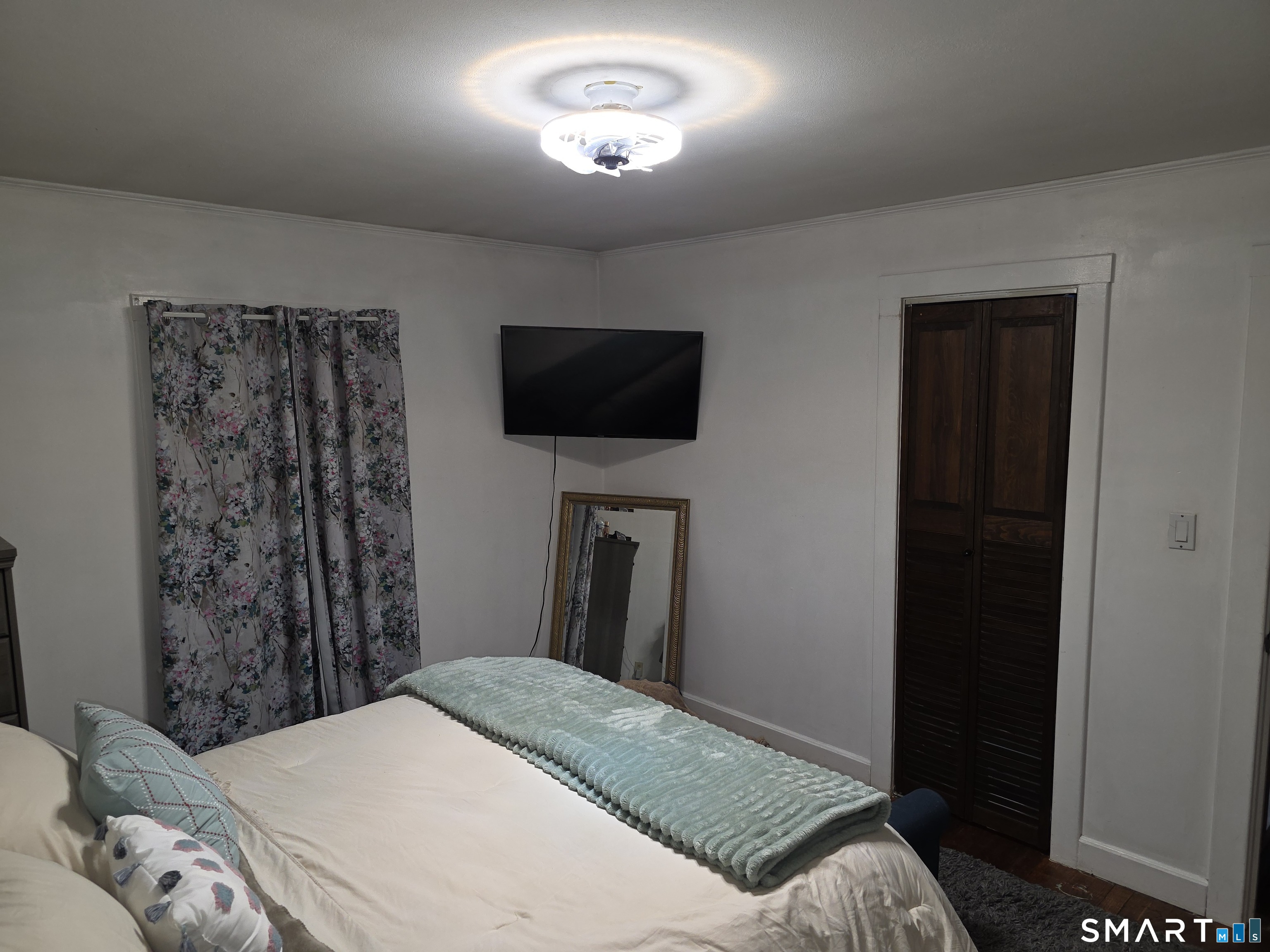 29 Esther Avenue Waterbury, CT 06708 - Photo 13 of 25 a bedroom with a bed and a flat screen tv