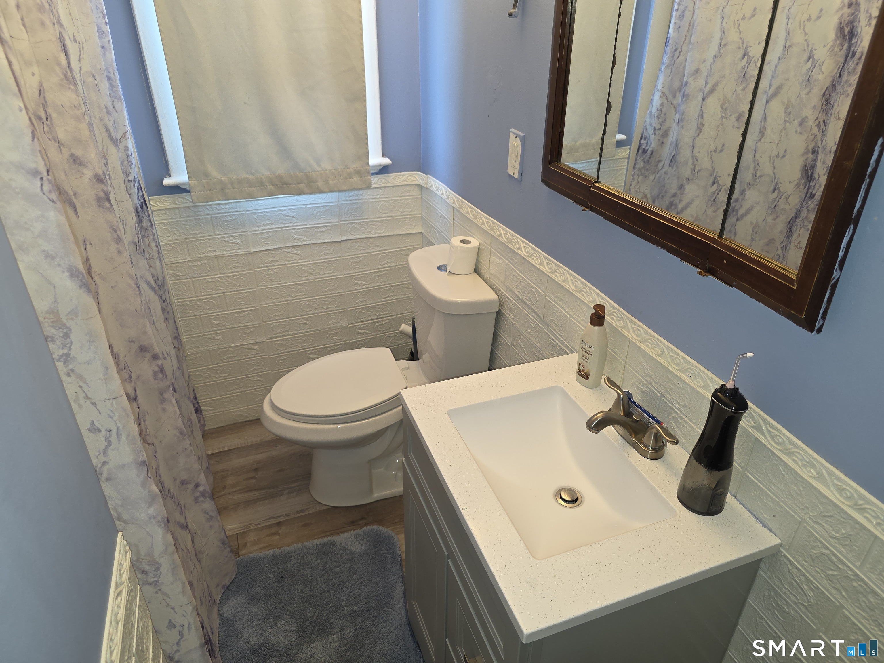 29 Esther Avenue Waterbury, CT 06708 - Photo 17 of 25 a bathroom with a sink a toilet and a mirror