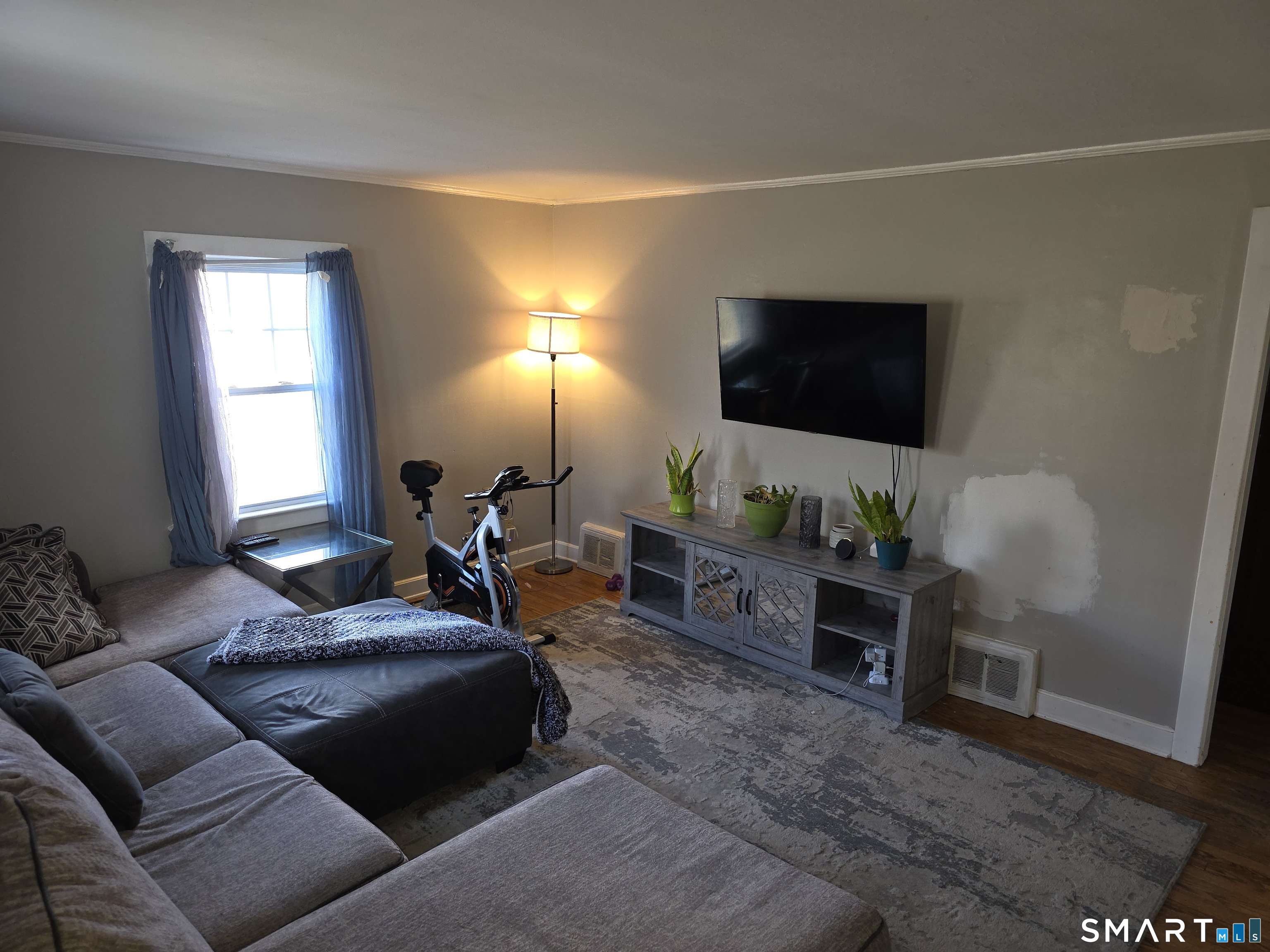 29 Esther Avenue Waterbury, CT 06708 - Photo 8 of 25 a living room with furniture and a flat screen tv