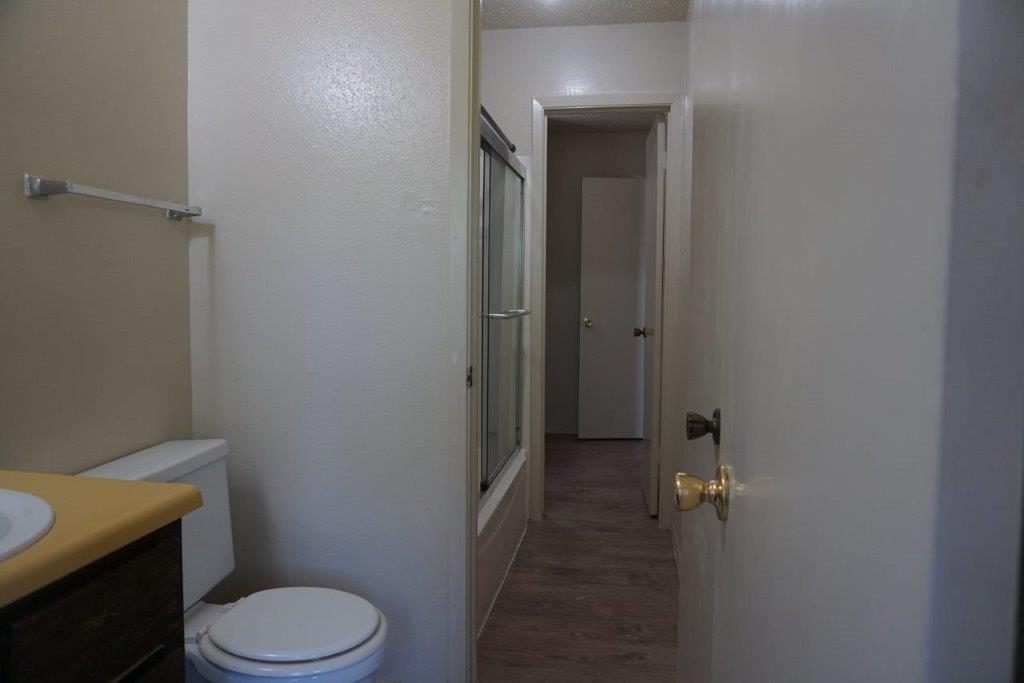 5919 Hidden Valley Trail Austin, TX 78744 - Photo 8 of 8 Functional full bathroom featuring a tub-shower combination and hard surface flooring.