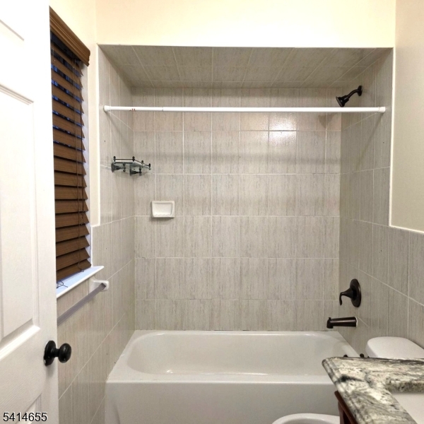 24 Van Vechten Street, Unit 3 Newark, NJ 07114 - Photo 21 of 36 a bathroom with a bathtub and a shower