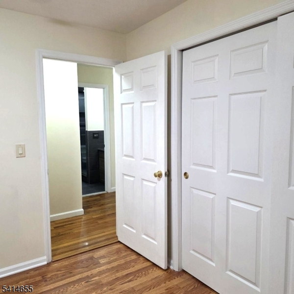 24 Van Vechten Street, Unit 3 Newark, NJ 07114 - Photo 28 of 36 a view of an empty room with wooden floor