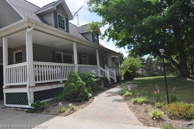 6120 North Burkhart Road Howell, MI 48855 - Photo 2 of 25 Covered Porch