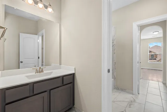 a bathroom with a sink and a mirror