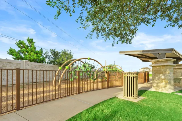 a view of a wrought iron fences in front of house