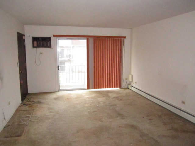 115 East Dundee Road, Unit 2N Wheeling, IL 60090 - Photo 2 of 16 an empty room with windows