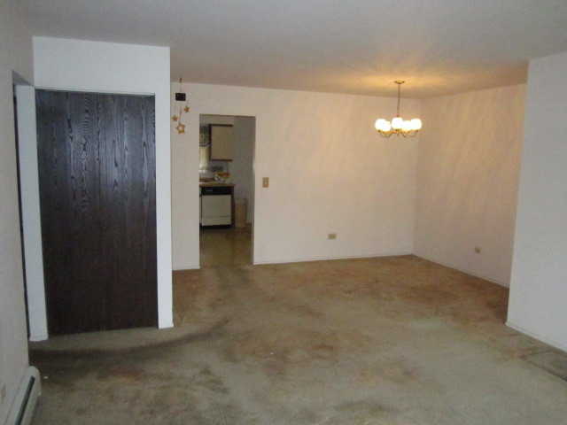 115 East Dundee Road, Unit 2N Wheeling, IL 60090 - Photo 3 of 16 an empty room with an empty space