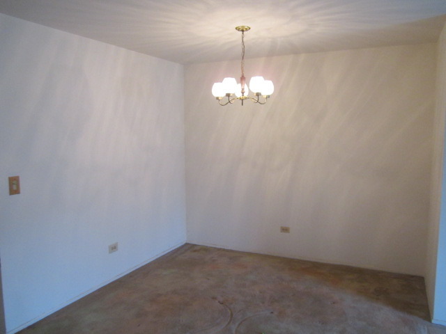 115 East Dundee Road, Unit 2N Wheeling, IL 60090 - Photo 4 of 16 a view of empty room with chandelier