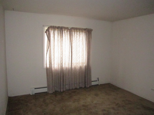 115 East Dundee Road, Unit 2N Wheeling, IL 60090 - Photo 9 of 16 an empty room with a window