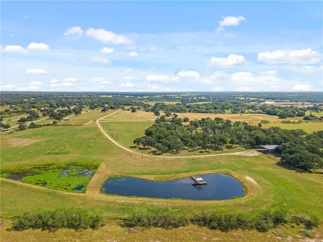 a picture of a bench in front of a building