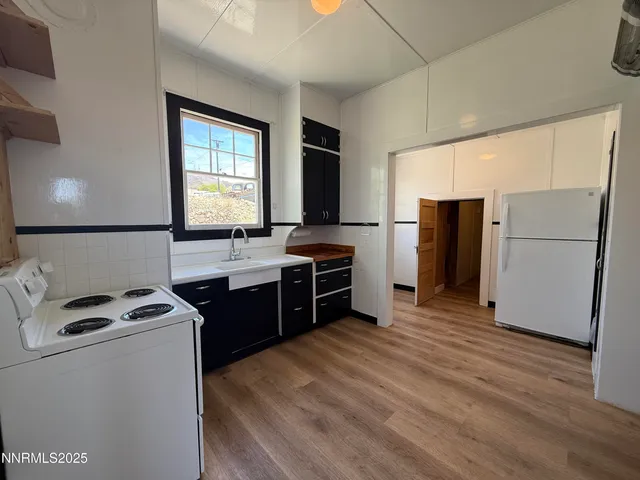 a kitchen with a sink and a stove