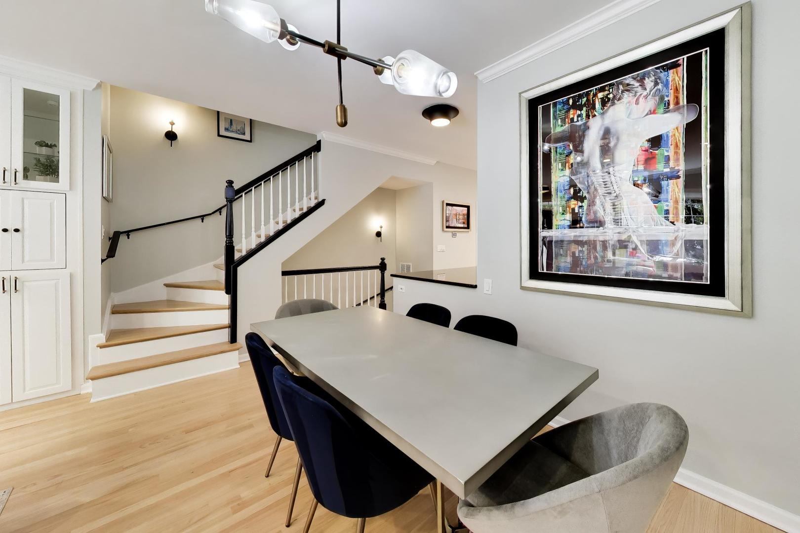 232 West Scott Street Chicago, IL 60610 - Photo 5 of 39 a view of a dining room with furniture and wooden floor