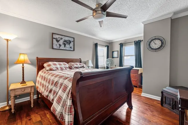 a bed room with a bed and a lamp