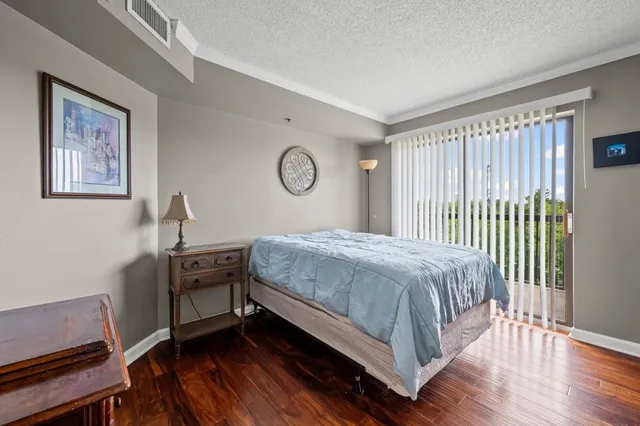 a bedroom with a bed and a desk