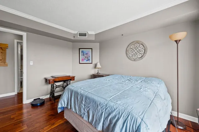 a bedroom with bed and a window