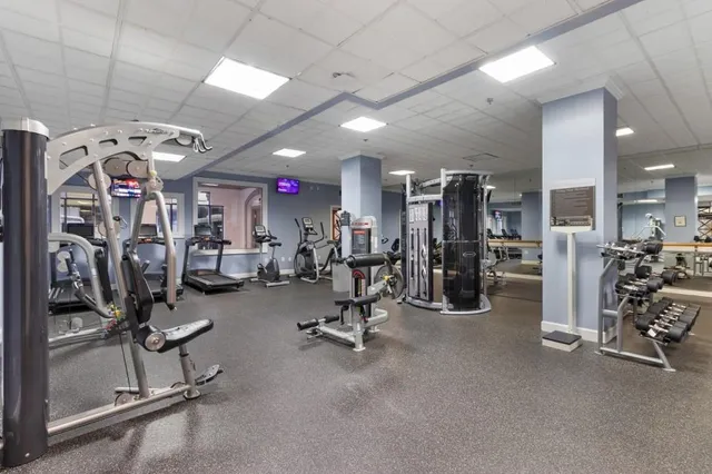 a view of a room with lots of stuff and hardwood floor