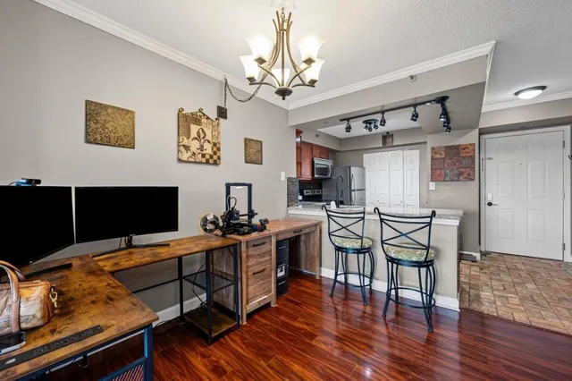a view of a livingroom with furniture and a flat screen tv